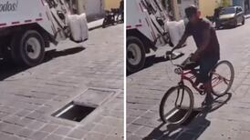 VIDEO| Ciclista cae en una coladera y se vuelve viral