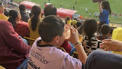 Captan a niño mientras toma cerveza en el Estadio Morelos