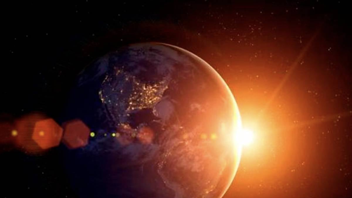 Imagen de la Tierra aproximándose al sol desde el espacio.