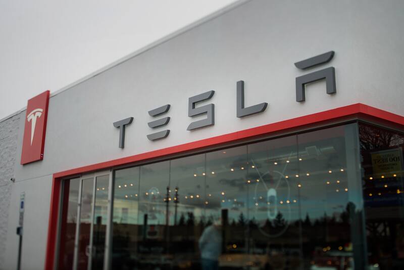 The Tesla Motors Inc. Gallery and Service Center stands in this photo taken with a tilt-shift lens in Paramus, New Jersey, U.S., on Thursday, Dec. 11, 2014. Tesla rose 1.2 percent at the end of trading mid last week to close at $216.89 after falling as low as $204.27. For the year, the shares have gained 44 percent. Photographer: Ron Antonelli/Bloomberg