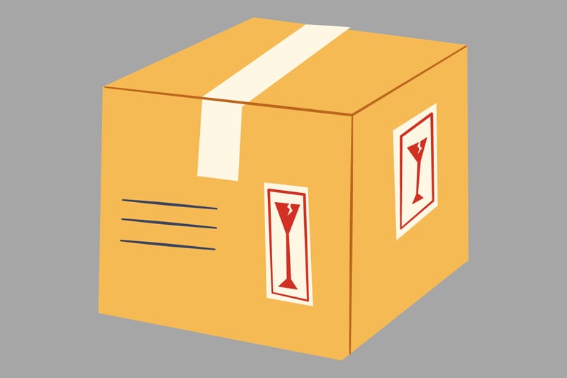 En este test visual hay una caja de embalaje amarilla, con un fondo gris.